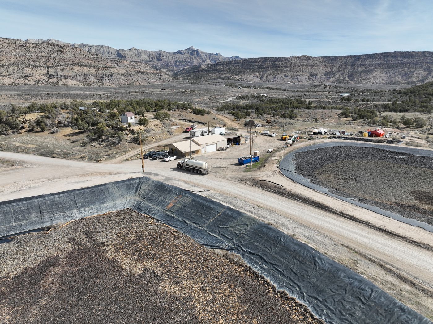 Synthetically lined impoundment at the Greenleaf facility with the valley beyond